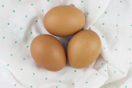 brown eggs and napkin with polka dot pattern. Happy Easter text, copy spaceの写真素材