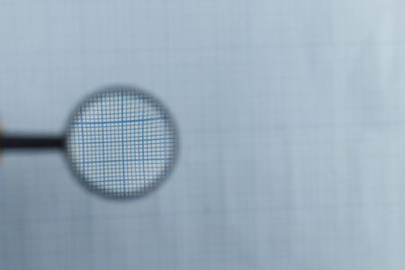 macro graph paper background with pen magnifier.