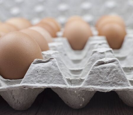 Close up of chicken eggs in package.
