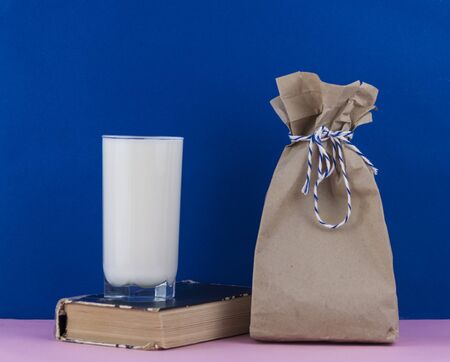 breakfast. Paper lunch bags with glass milkの写真素材