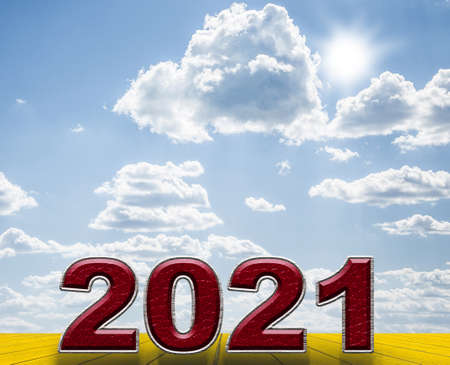Happy new year 2021 text on wooden pine table and blur blue sky background. Banner with copy space...
