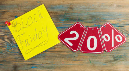 Black Friday handwriting text close up on sticky notes with copy space. Writing text on memo post...