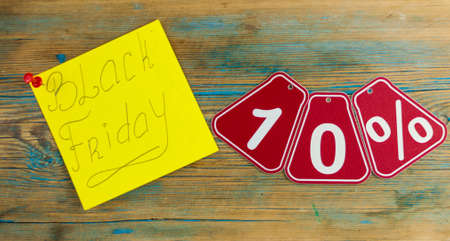 Black Friday handwriting text close up on sticky notes with copy space. Writing text on memo post...