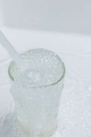 pouring water into a glass