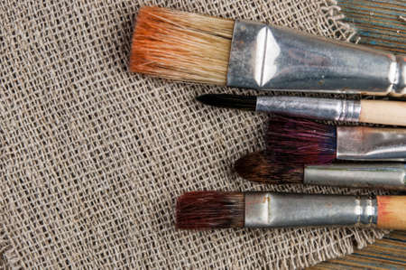 old brushes on a linen cloth backgroundの写真素材