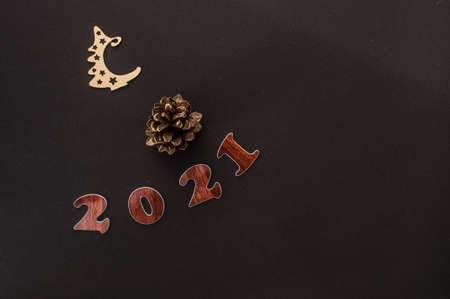 Happy New year 2021 celebration. Numeral 2021 on a dark background. The inscription postcard for...