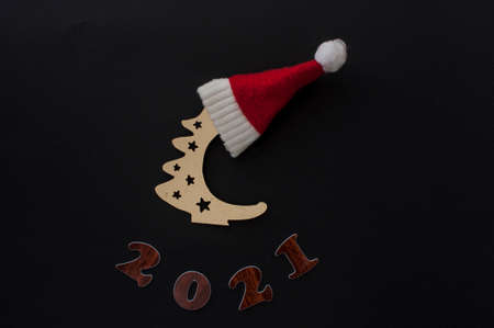 Happy New year 2021 celebration. Numeral 2021 on a dark background. The inscription postcard for Christmas or New Year.の写真素材