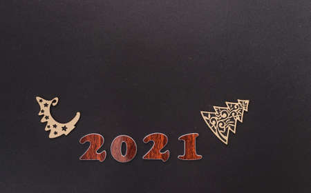 Happy New year 2021 celebration. Numeral 2021 on a dark background. The inscription postcard for...