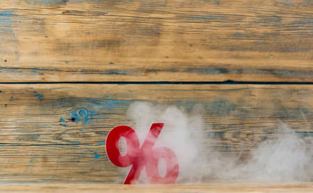 sign percent with smokey background