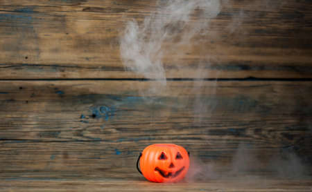 Scary Halloween pumpkin with the smoke. Jack-o-lantern. All Saint's day.の写真素材