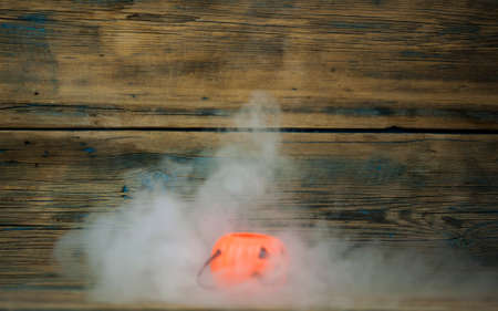 Scary Halloween pumpkin with the smoke. Jack-o-lantern. All Saint's day.の写真素材
