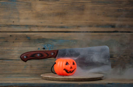 Scary Halloween pumpkin with the smoke. Jack-o-lantern. All Saint's day.