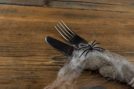 Halloween table setting on old rustic wooden table holiday card template copy space. Menu cardの写真素材