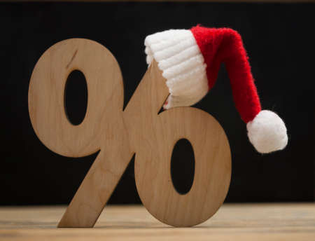 Symbol of percent and a christmas hatの写真素材
