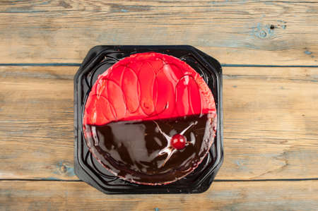 delicious cake with cherries and chocolate creamの写真素材