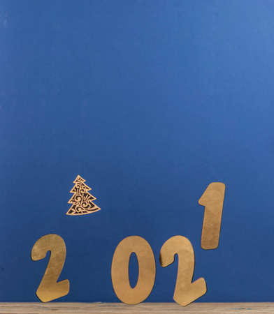 Flying in the form of New Year's numbers 2021 on a blue background. Happy New Year 2021 and Merry...