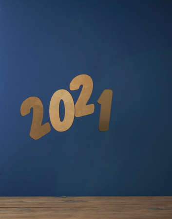 Flying in the form of New Year's numbers 2021 on a blue background. Happy New Year 2021 and Merry Christmas. Number levitation. Winter concept close-up.の写真素材
