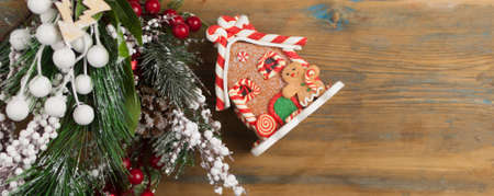 Festive Christmas decoration and fir tree on wooden background with space for your textの写真素材