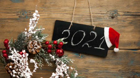 Festive Christmas decoration and fir tree on wooden background with space for your text