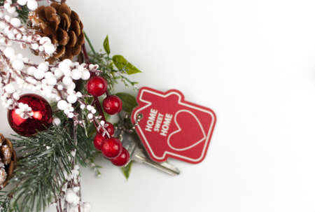 Beautiful Christmas background: decorative house and key to the lock. Concept of finance and housing loans. Top viewの写真素材