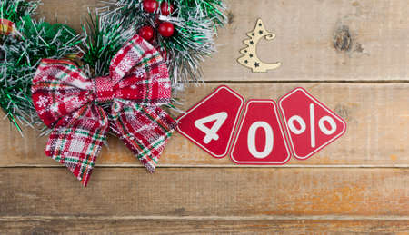 Big sales 40%, forty percents with Christmas wreath on a old barn plank background, top view, copy space. Christmas big sale.の写真素材