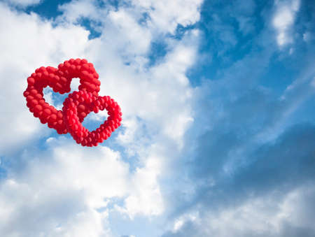 heart-shaped baloon in the sky, the symbols of loveの写真素材