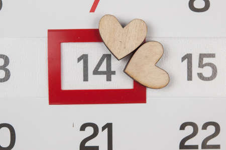 Calendar page with the red hearts on February 14 of Saint Valentines day.の写真素材