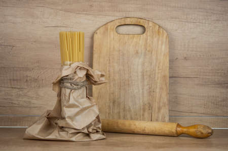 italian spaghetti on wooden background.の写真素材