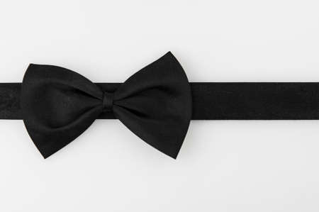 black ribbon bow tie on white background