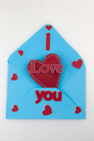 Happy valentine's day concept. Flat lay top view photo of blue open envelope with paper card in...