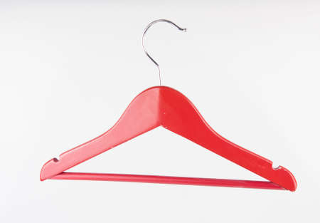 Single empty cloth hanger on white backgroundの写真素材
