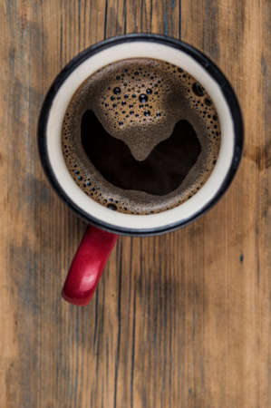 Top view of coffee cup on a wood background with copy space.の写真素材