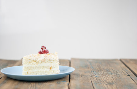 Delicious of piece cake on plate on wood tableの写真素材