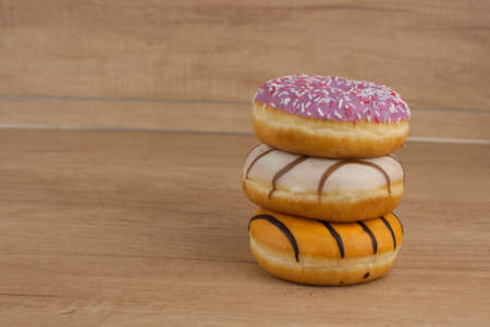 colorful donuts or donut on wooden table background.の写真素材