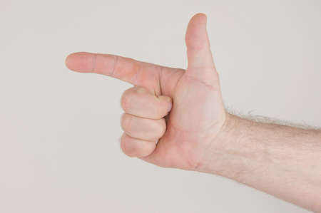 men hand with index finger on a white background