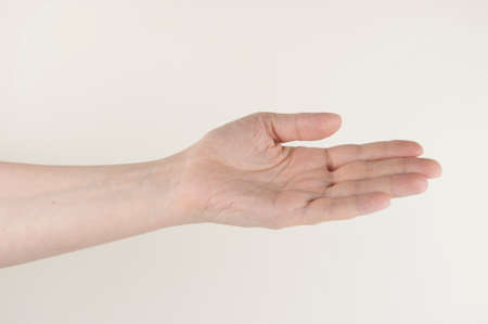 Close up hand and arm on white background. Can use for show your product.の写真素材