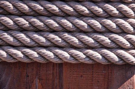 vintage background with old rope on wood planksの写真素材