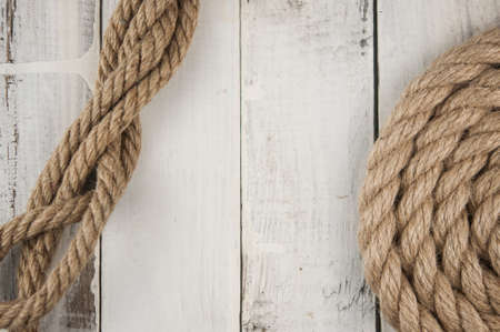 Image of old texture of white wooden boards with ship rope.