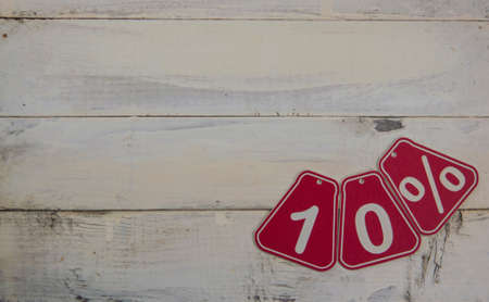 ten percent discount on Halloween background - price tag on a rustic old white wooden background