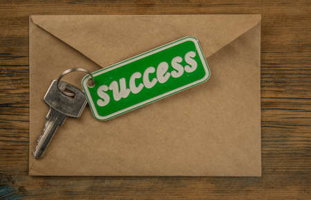 Silver key to success concept with label or tagの写真素材