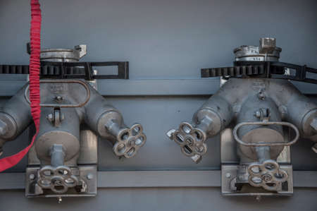 Compartment of rolled up fire hoses on a fire engine. Rescue fire truck equipment.の写真素材