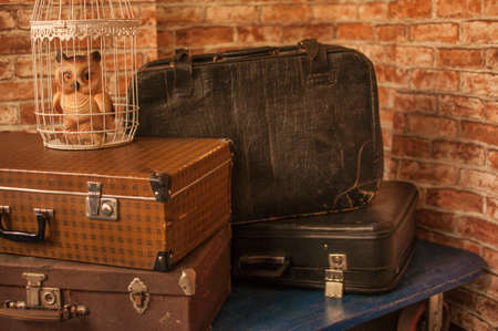 old suitcases lie on the floor on top of each other. suitcases for travelの写真素材