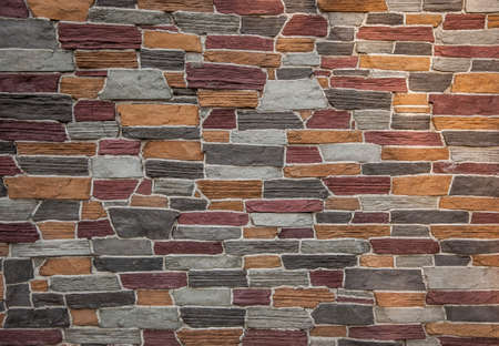 Abstract background of colorful stone wall texture. Copy space