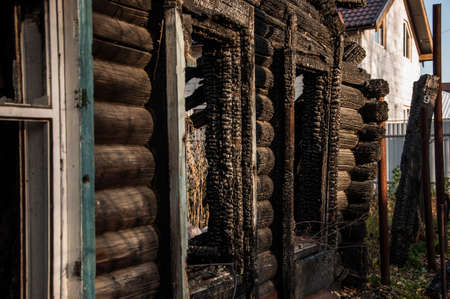 Old wooden house after the fire burned
