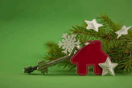 Beautiful Christmas background: decorative house and key to the lock. Concept of finance and housing loans. Top viewの写真素材