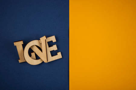 Love word, small hearts on colorful paper background. Top view of Valentine's Day. copyspace.の写真素材