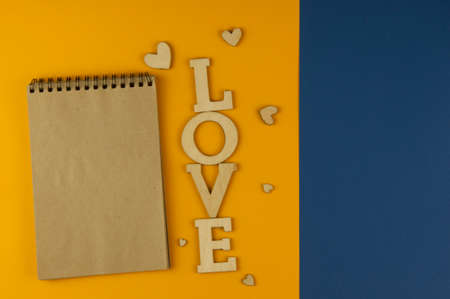 Love word, small hearts on colorful paper background. Top view of Valentine's Day. copyspace.の写真素材