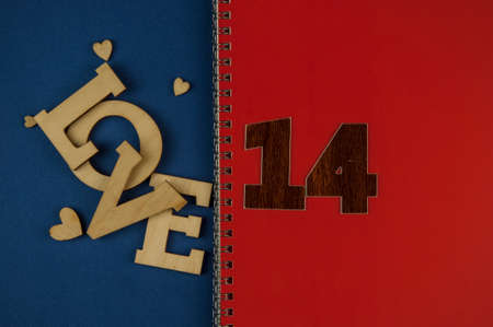Love word, small hearts on colorful paper background. Top view of Valentine's Day. copyspace.の写真素材