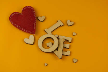 Love word, small hearts on colorful paper background. Top view of Valentine's Day. copyspace.の写真素材