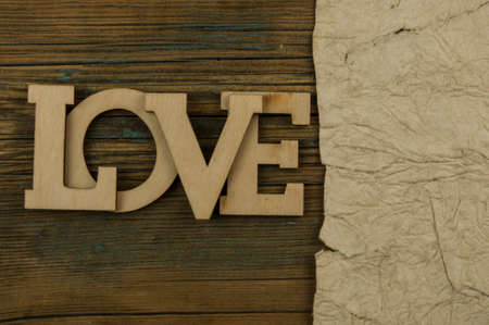 Love word, small hearts on old wood background. Top view of Valentine's Day. copyspace.の写真素材